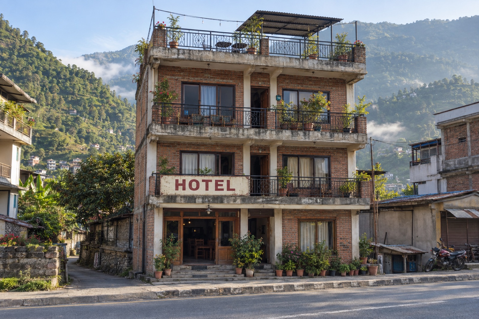 A family-run brick guesthouse with balconies and a rooftop terrace on the main street of Baglung bazaar