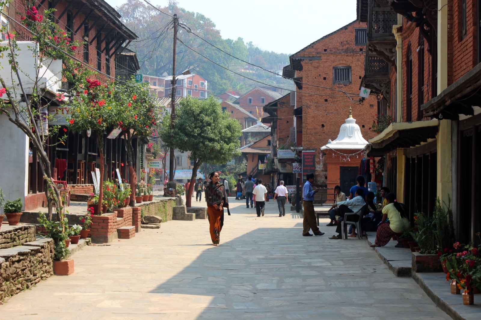 The car-free flagstone bazaar of Bandipur, lined with restored Newari merchant houses and a white chaitya