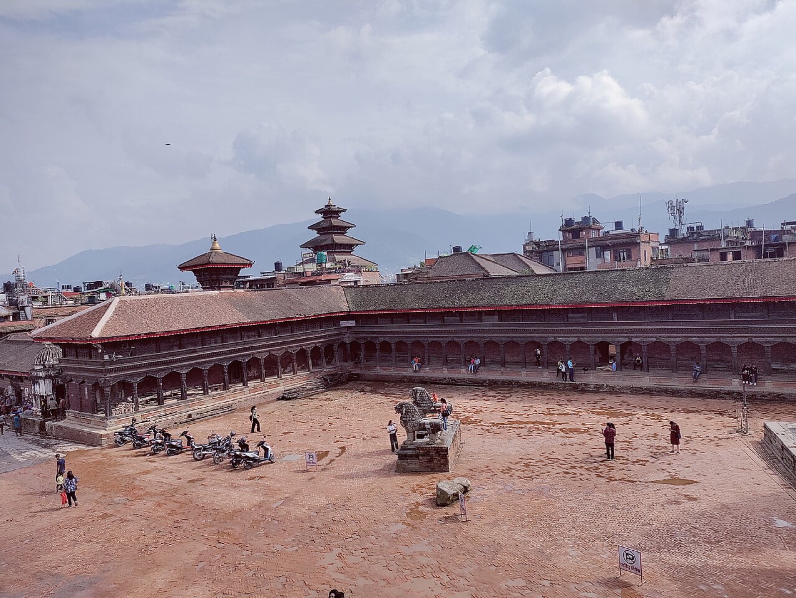 The brick expanse of Bhaktapur Durbar Square with its palace colonnade and temple roofs