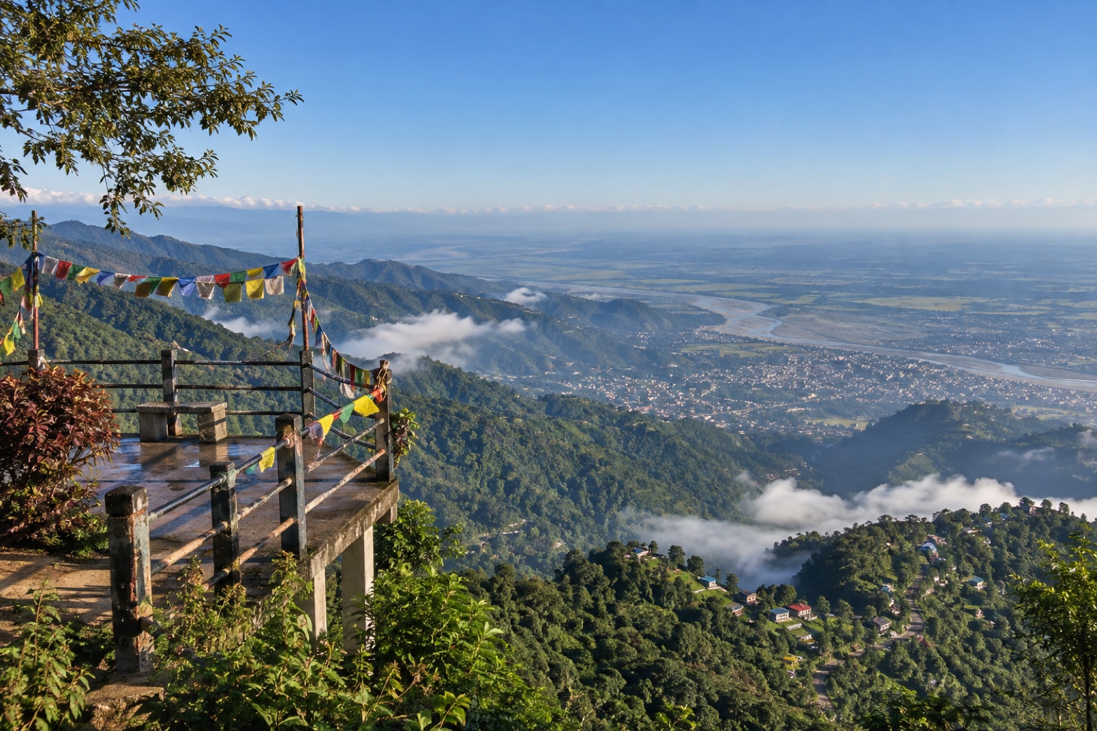 The Bhedetar viewpoint above Dharan on a clear autumn morning, looking down over the hills to the Terai plain