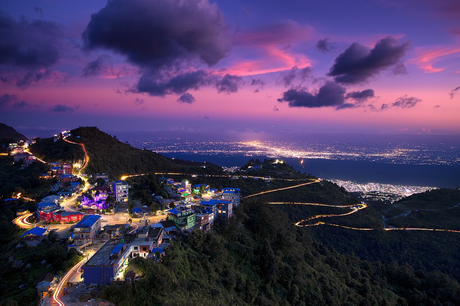 Dusk at the Bhedetar viewpoint above Dharan, with the city lights and the eastern Terai plain below