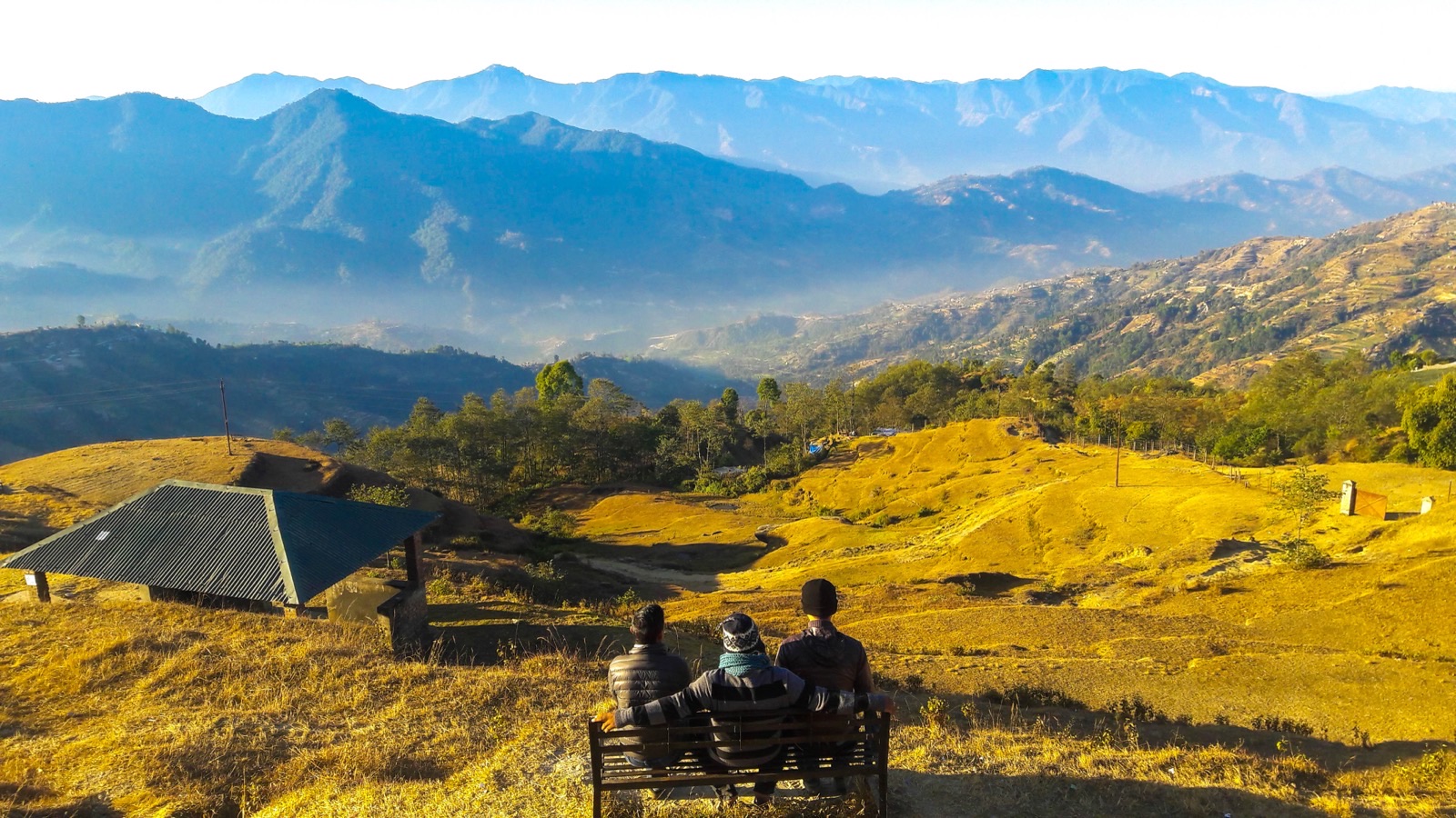 Golden-hour view from the Kakani ridge over the layered hills on the rim of the Kathmandu Valley