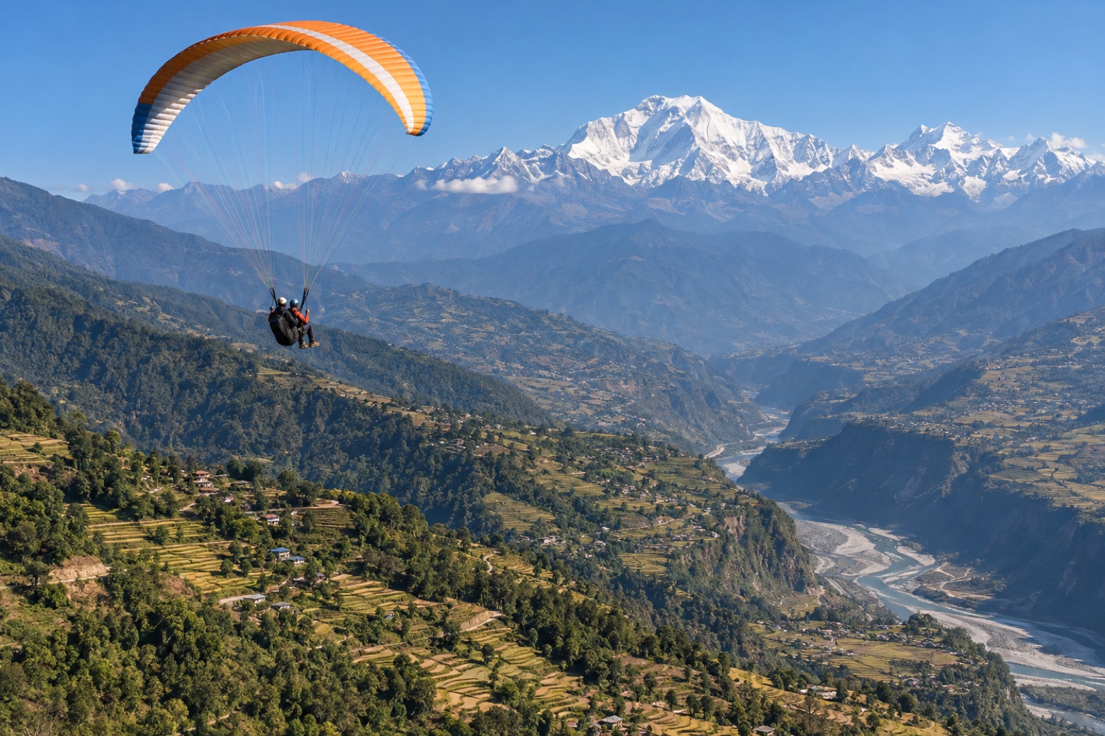 A tandem paraglider over the terraced ridges above Baglung, with the Kali Gandaki valley and Dhaulagiri beyond