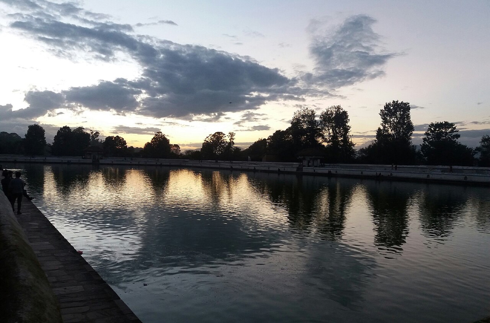 Siddha Pokhari, the large walled pond on the edge of Bhaktapur, at dusk